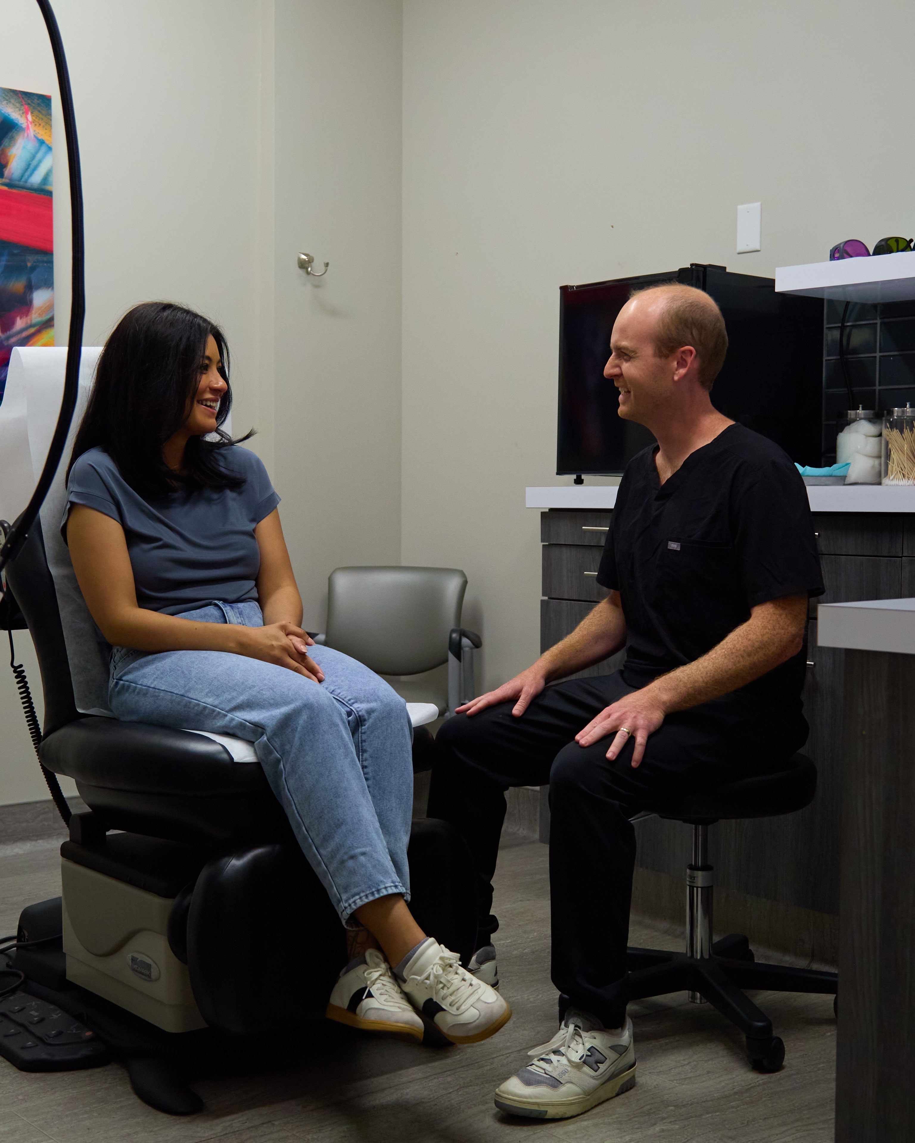 A patient and clinician talking easily in the exam room