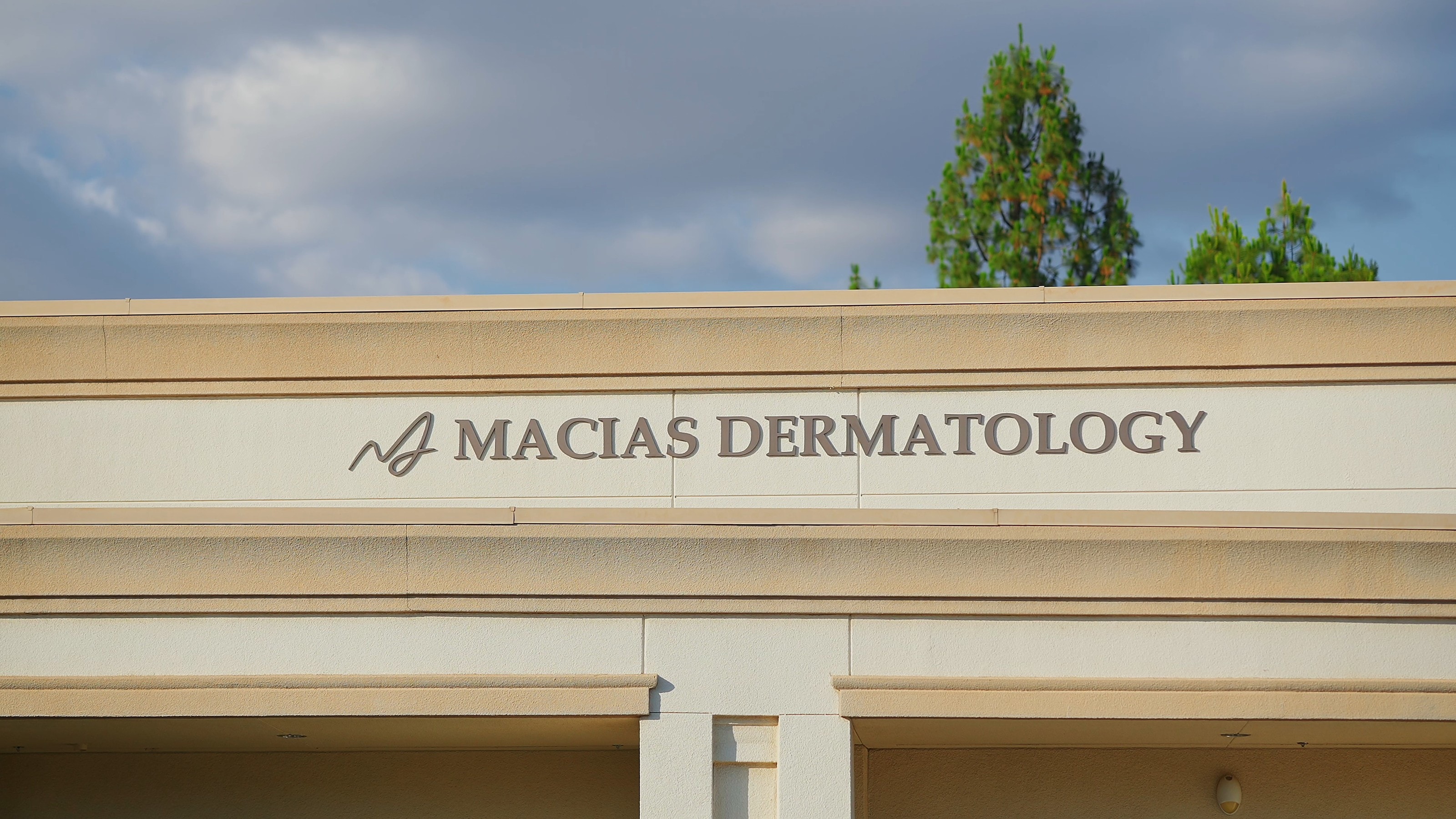 The Macias Dermatology sign above the clinic entrance