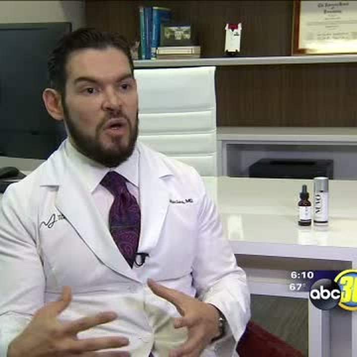 Dr. Edgar Macias interviewed at his desk in the 2016 ABC30 segment