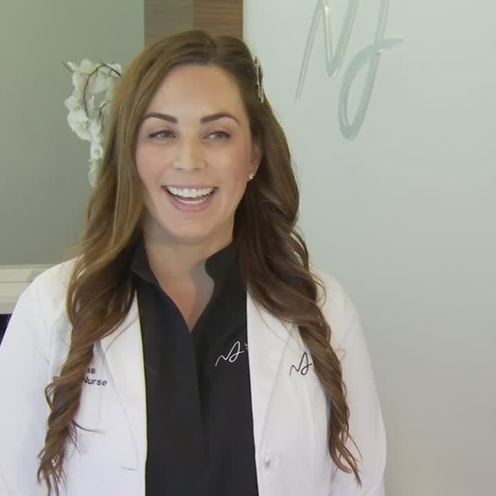 Aesthetic registered nurse Erin Freitas smiling in the ABC30 segment at Macias Dermatology