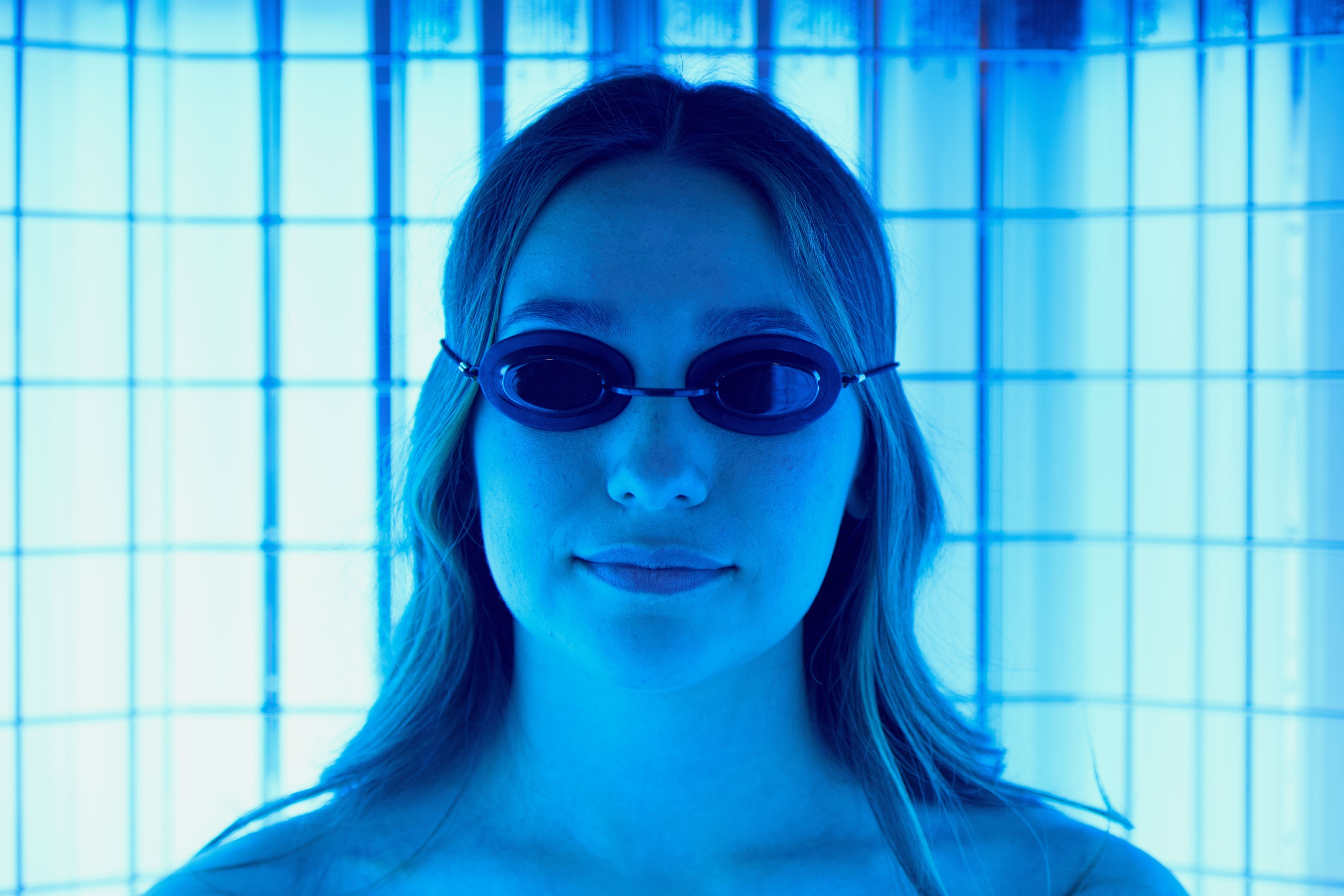A patient in protective goggles during a narrow band UVB session