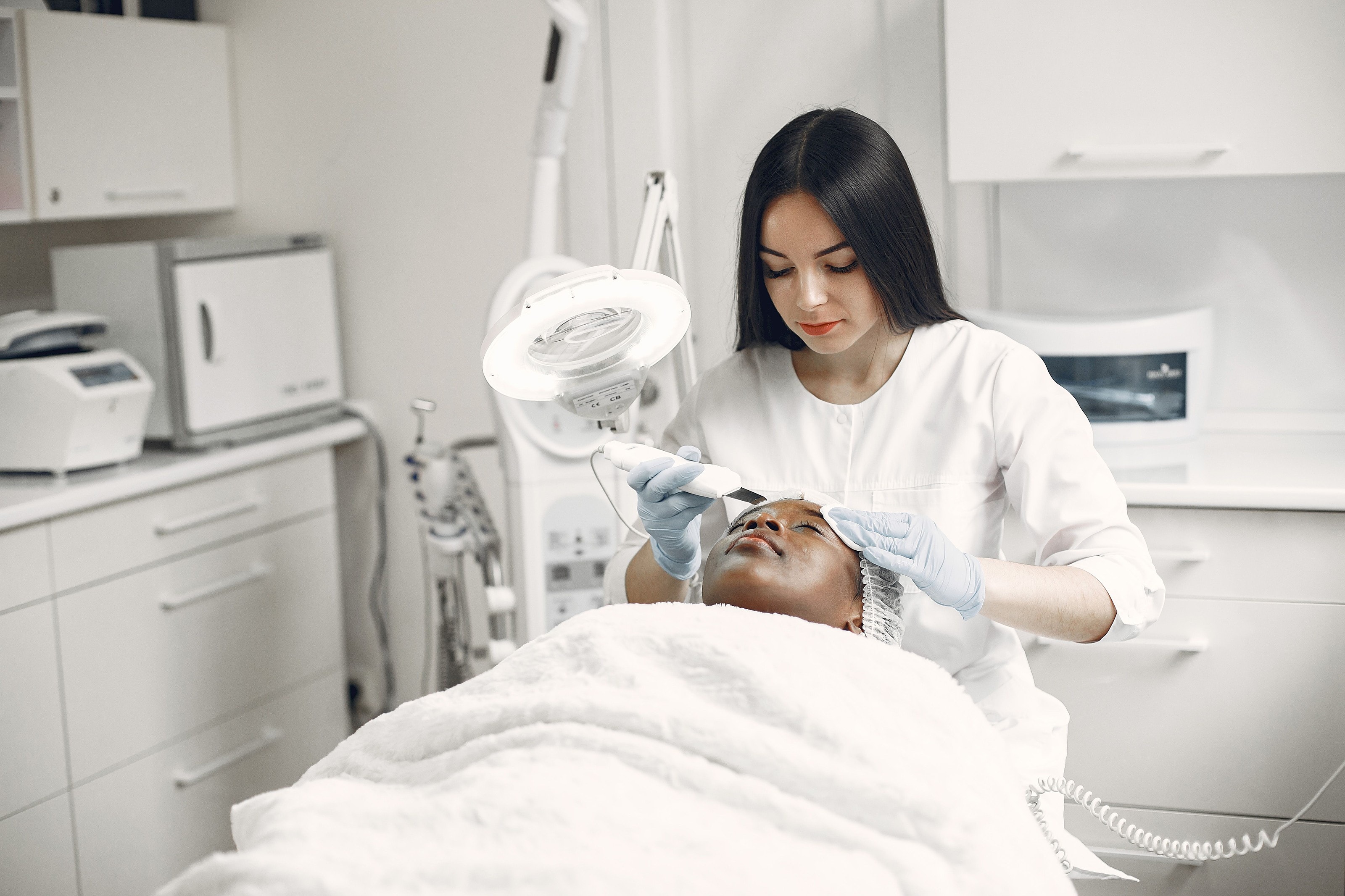A patient resting during a precise facial treatment