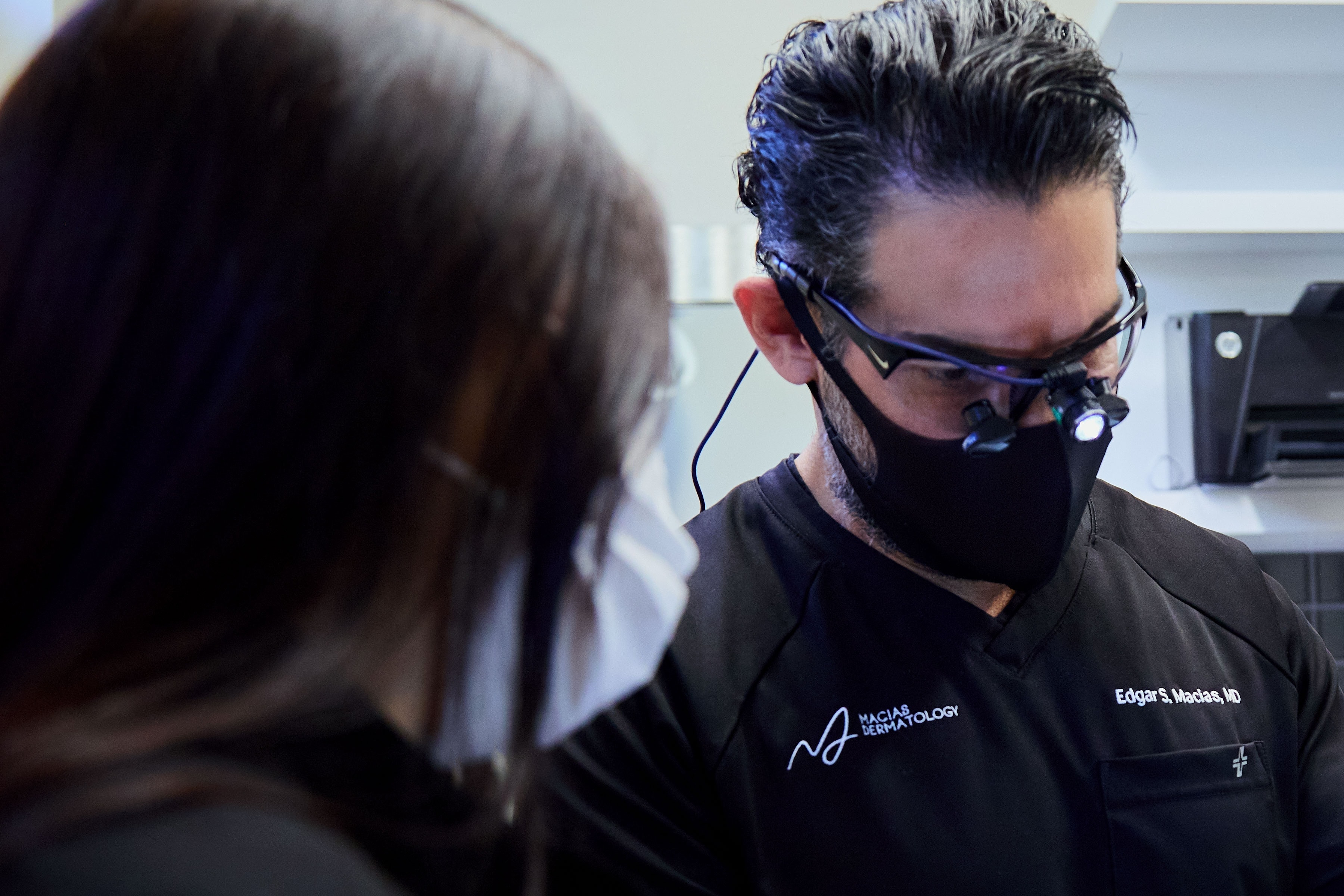 Dr. Macias and a team member working together in the treatment room