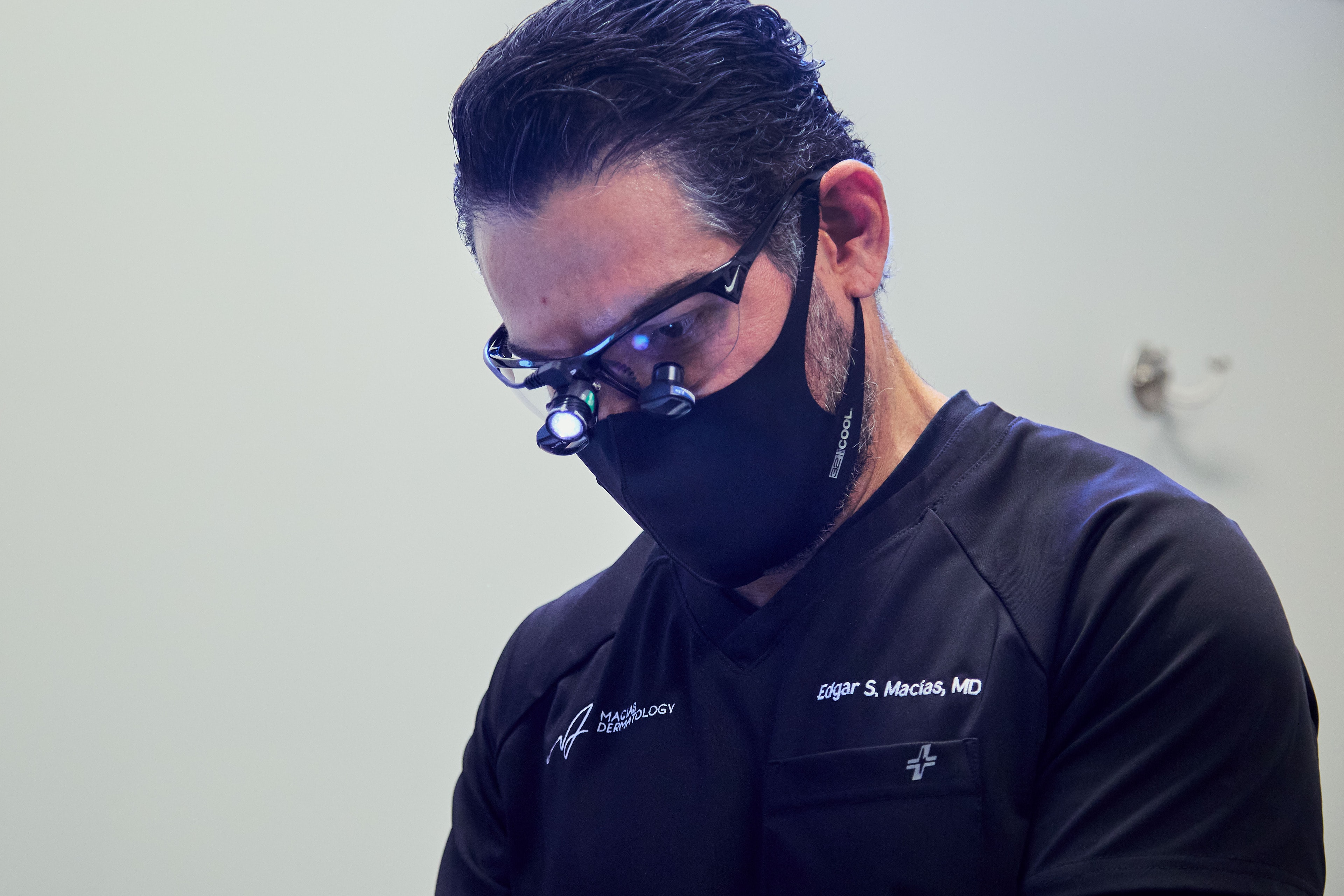 Dr. Macias in surgical loupes during a procedure