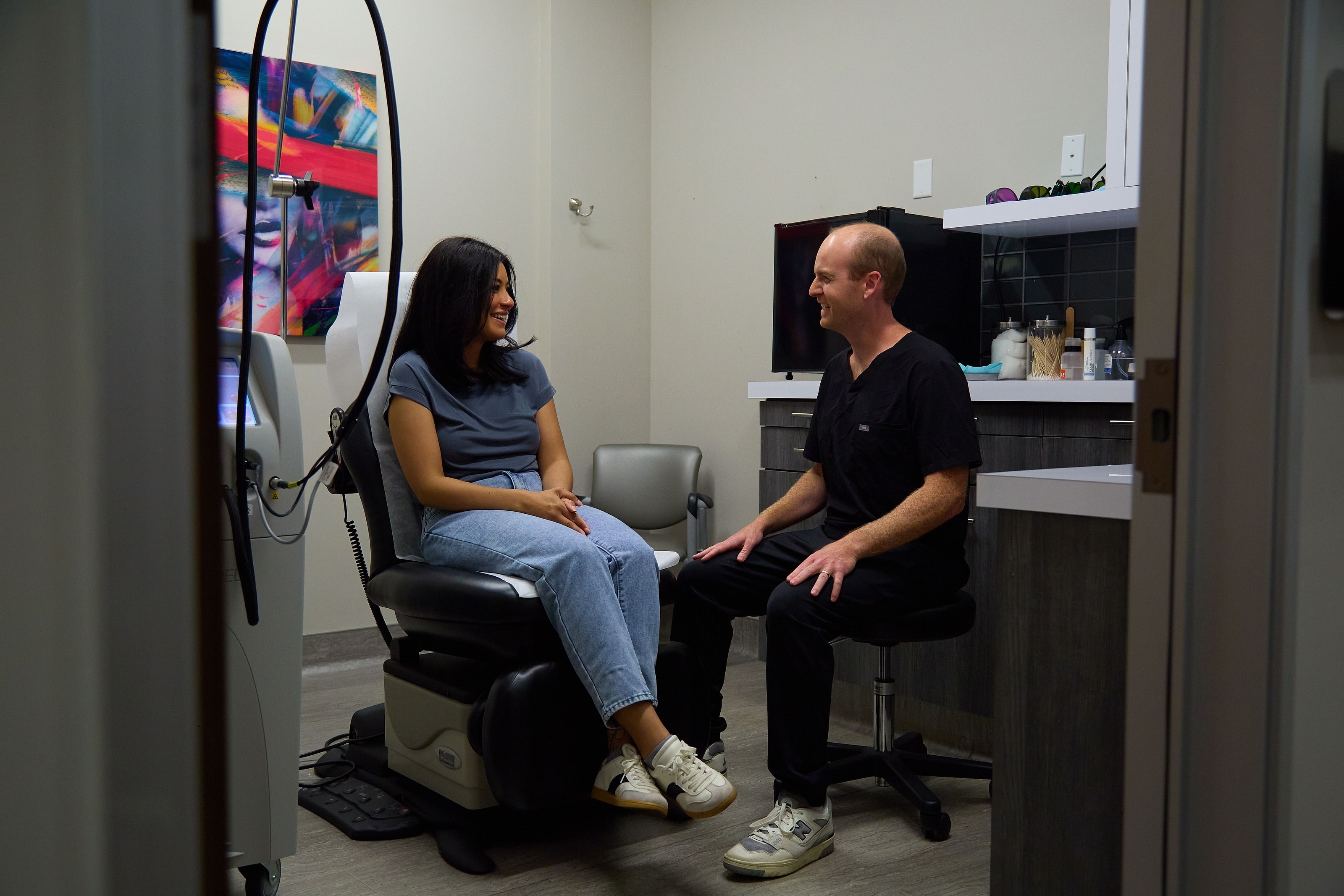 A patient and practitioner talking during a consultation