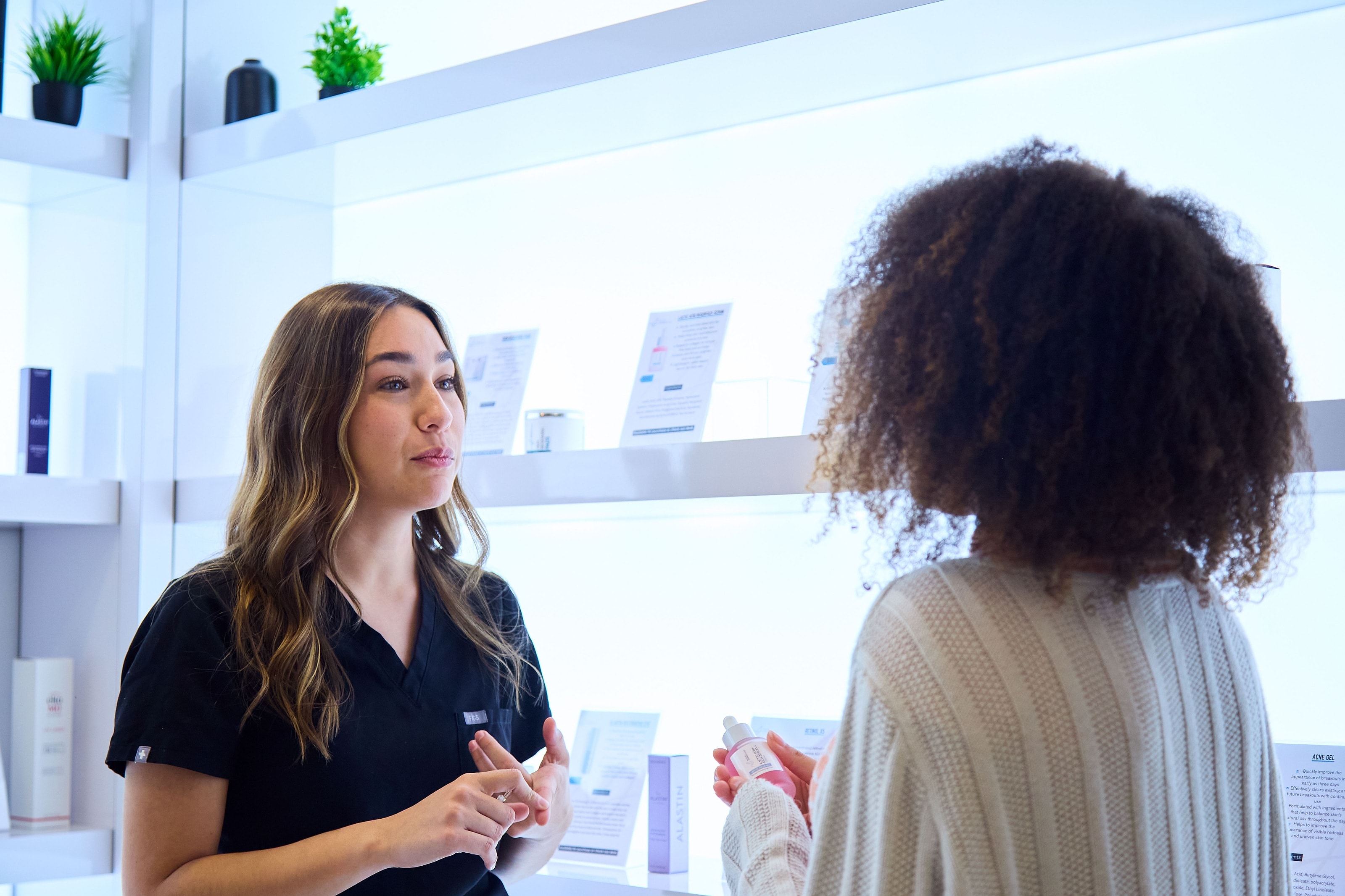A team member in unhurried conversation with a patient at the clinic