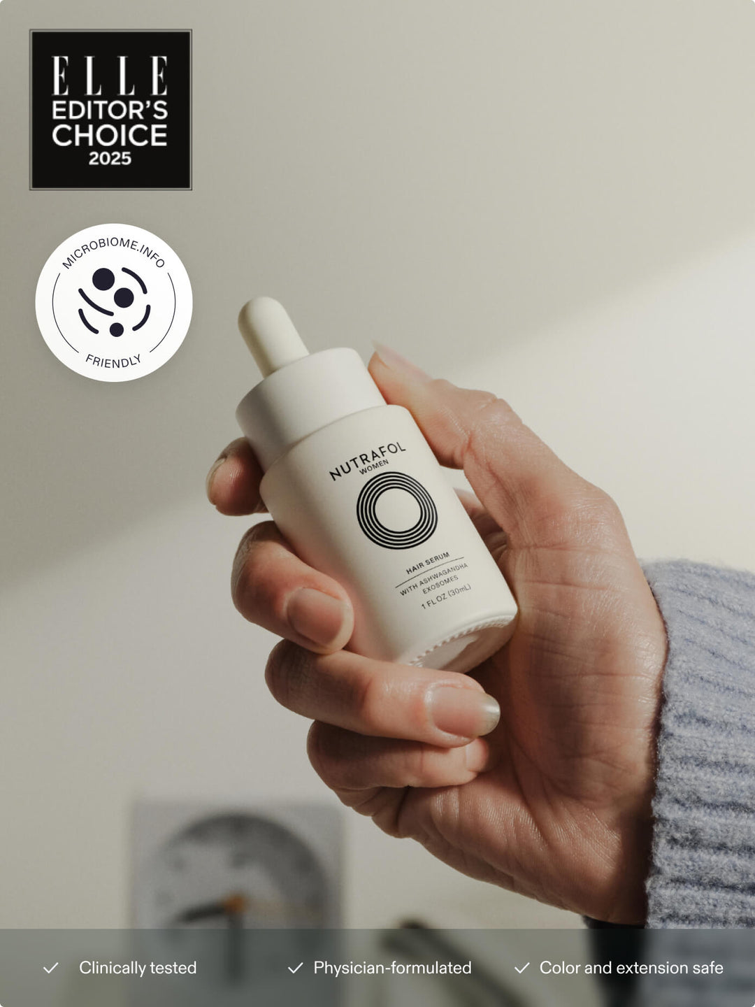 Nutrafol Hair Serum dropper bottle on a white background